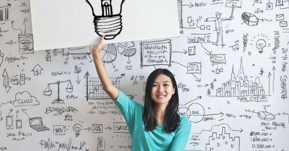 Closet Solution - Woman Draw a Light bulb in White Board