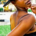 Sustainable Fashion - Portrait of African Woman Wearing a Hat