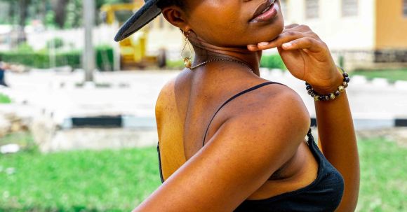 Sustainable Fashion - Portrait of African Woman Wearing a Hat