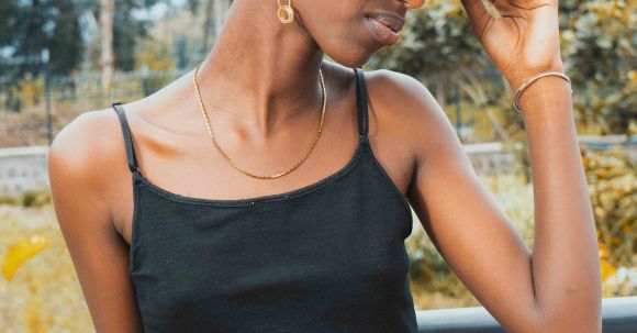 Budget Fashion - Portrait of African Woman Wearing a Hat