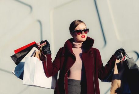 Fashion Revolution - photo of woman holding white and black paper bags