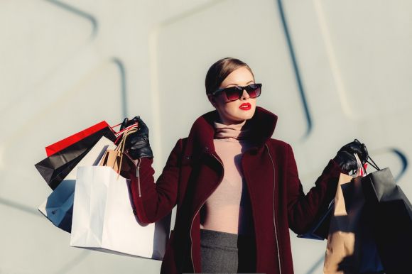 Fashion Revolution - photo of woman holding white and black paper bags