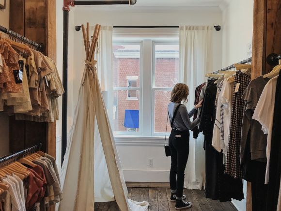 Clothing - woman standing selecting clothes