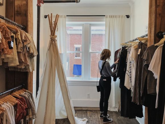 Clothing - woman standing selecting clothes